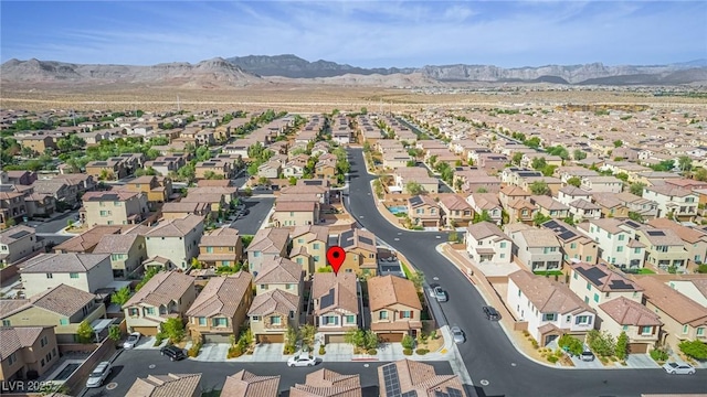 bird's eye view featuring a mountain view and a residential view