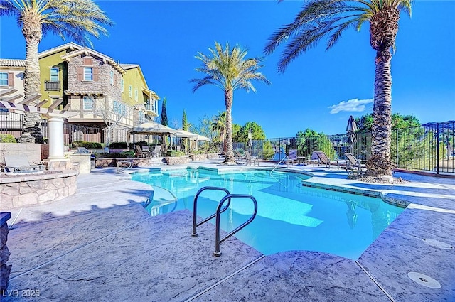 pool featuring a patio area, fence, and a gazebo