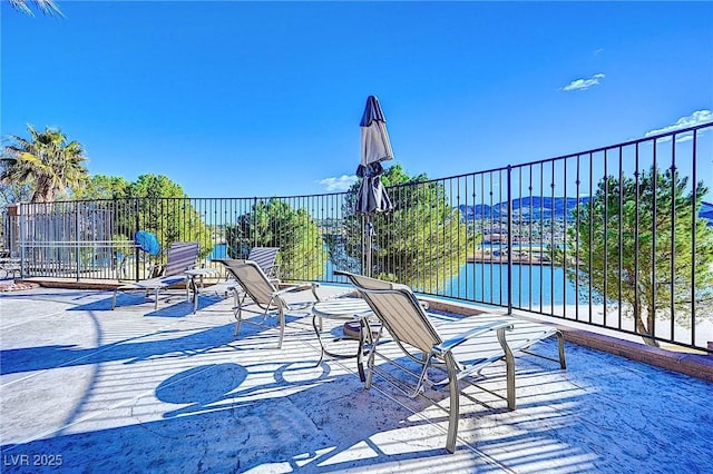 view of patio featuring a water view