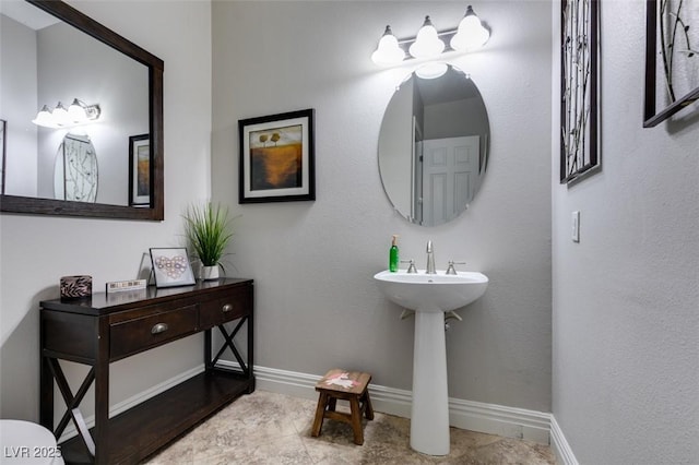 bathroom with baseboards