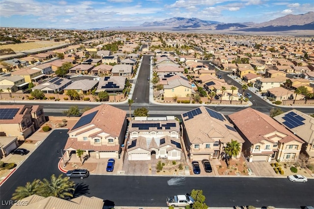 birds eye view of property featuring a mountain view and a residential view