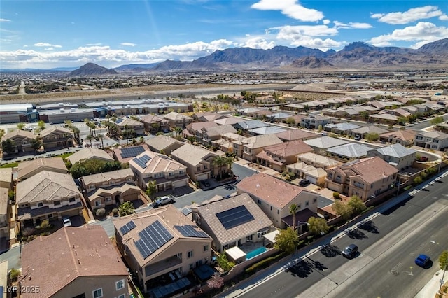 drone / aerial view featuring a residential view and a mountain view