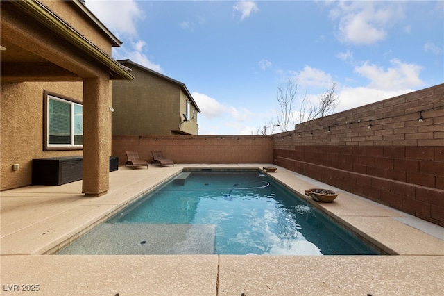 view of swimming pool featuring a patio area, a fenced backyard, and a fenced in pool