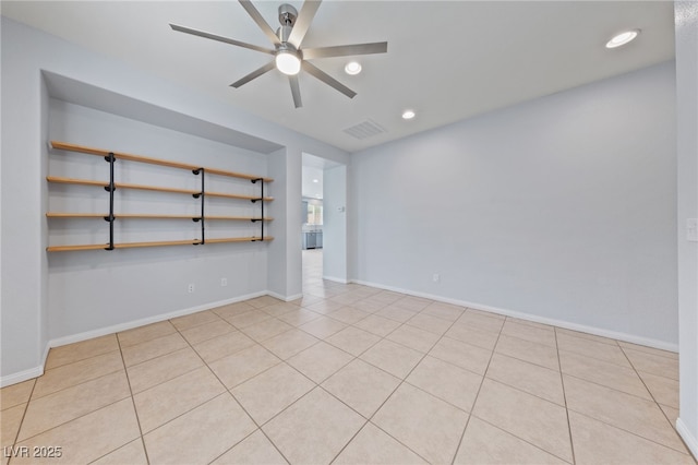 empty room featuring a ceiling fan, visible vents, baseboards, recessed lighting, and tile patterned floors