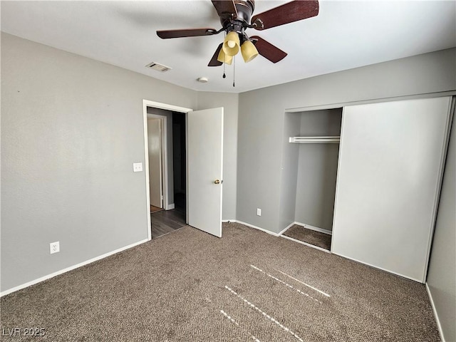 unfurnished bedroom featuring carpet, a closet, visible vents, a ceiling fan, and baseboards