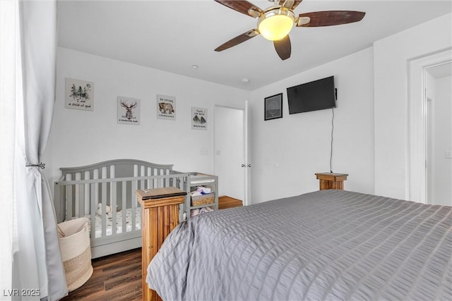 bedroom with wood finished floors and a ceiling fan