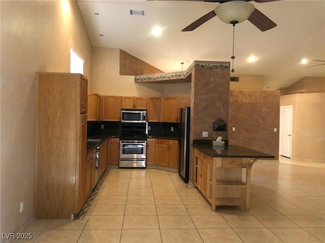 kitchen with dark countertops, visible vents, light tile patterned floors, appliances with stainless steel finishes, and open shelves