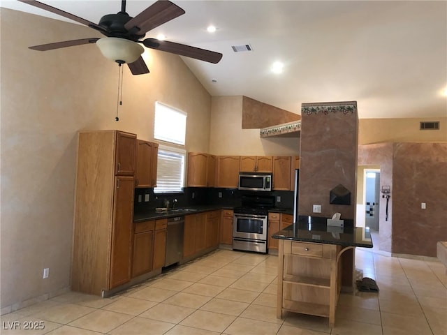 kitchen featuring dark countertops, visible vents, appliances with stainless steel finishes, and open shelves