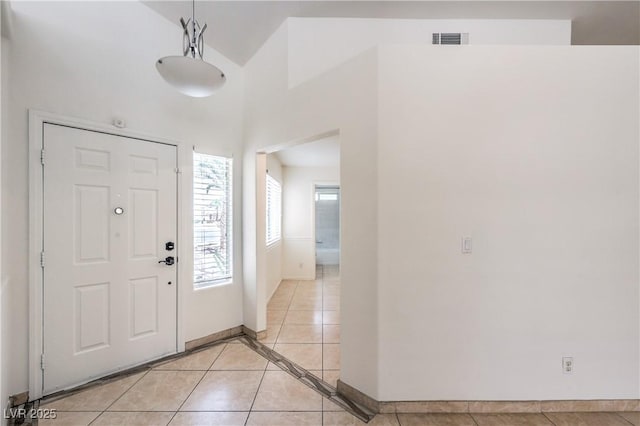 7613 Falconwing Ave, Las Vegas, NV 89131 - foyer with baseboards, light tile patterned flooring, and a towering ceiling