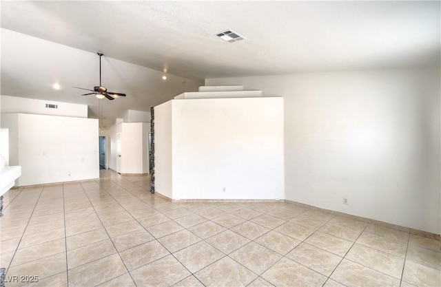 7613 Falconwing Ave, Las Vegas, NV 89131 - spare room featuring light tile patterned floors, vaulted ceiling, and ceiling fan