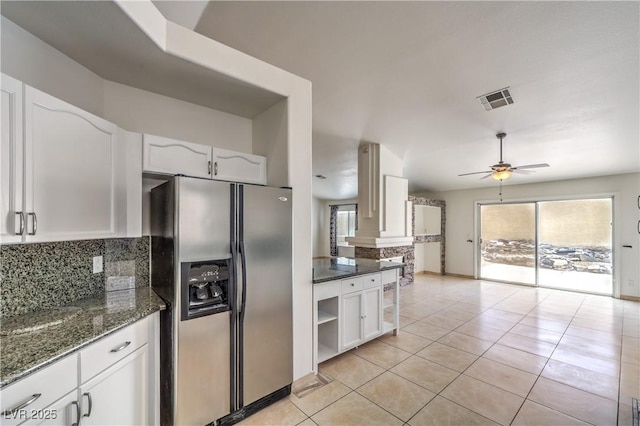 7613 Falconwing Ave, Las Vegas, NV 89131 - kitchen featuring stainless steel fridge, tasteful backsplash, a ceiling fan, white cabinets, and light tile patterned floors