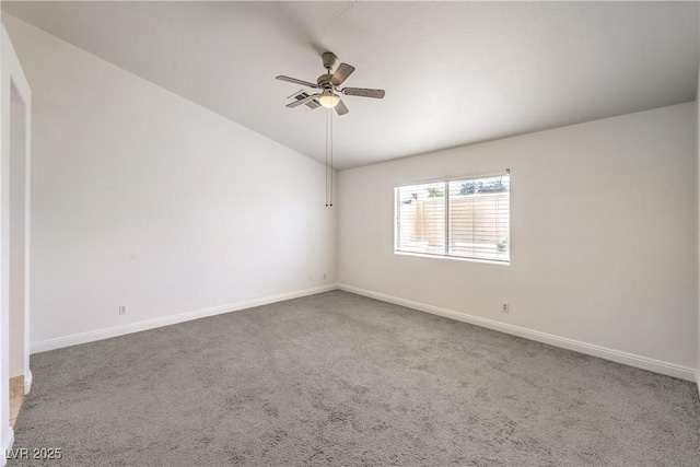 7613 Falconwing Ave, Las Vegas, NV 89131 - spare room with vaulted ceiling, a ceiling fan, carpet flooring, and baseboards