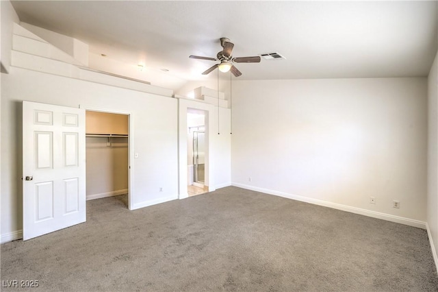 7613 Falconwing Ave, Las Vegas, NV 89131 - unfurnished bedroom featuring carpet floors, baseboards, a spacious closet, a closet, and vaulted ceiling