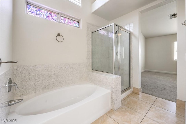 7613 Falconwing Ave, Las Vegas, NV 89131 - bathroom featuring a bath, tile patterned flooring, and a stall shower