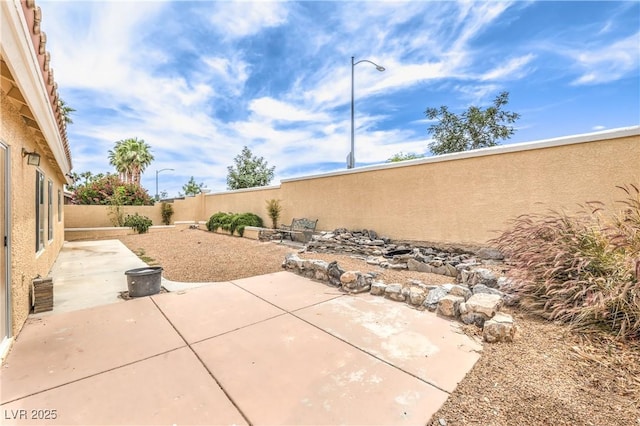7613 Falconwing Ave, Las Vegas, NV 89131 - fenced backyard featuring a patio area