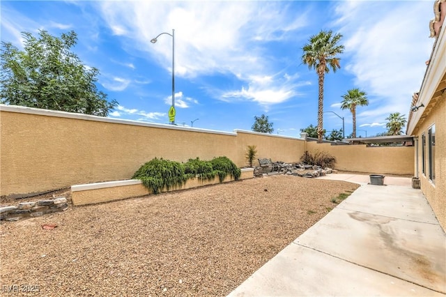 7613 Falconwing Ave, Las Vegas, NV 89131 - fenced backyard featuring a patio area