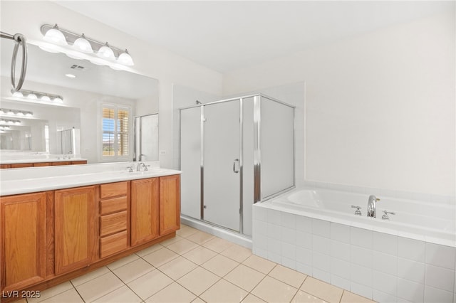 full bathroom featuring tile patterned floors, visible vents, a stall shower, and a bath