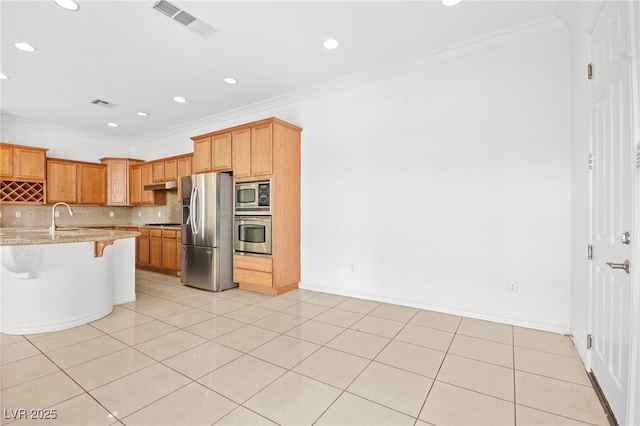 kitchen featuring a breakfast bar, appliances with stainless steel finishes, crown molding, light tile patterned floors, and decorative backsplash