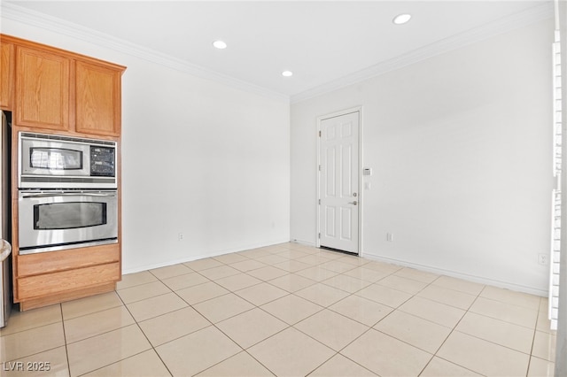 kitchen with light tile patterned floors, recessed lighting, stainless steel appliances, and crown molding