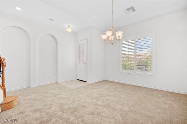 empty room with visible vents, recessed lighting, arched walkways, an inviting chandelier, and carpet flooring