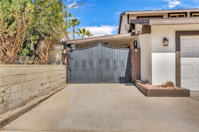 view of gate featuring fence