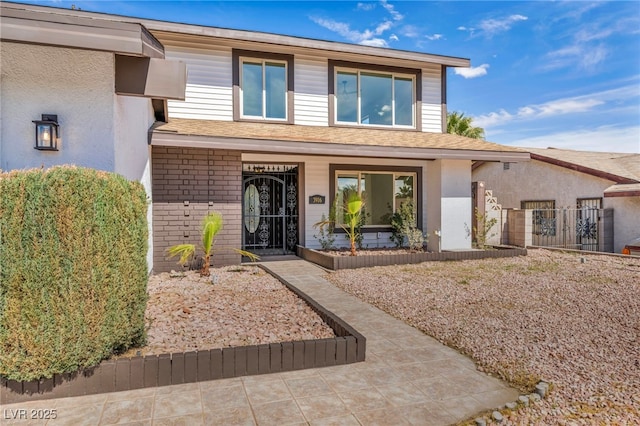 view of front of house with brick siding