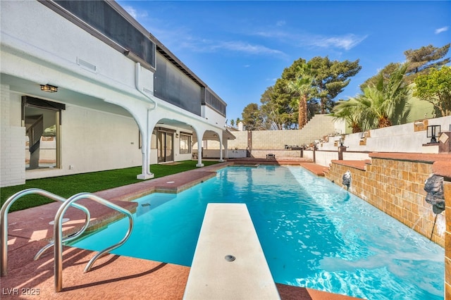 view of swimming pool with a patio, a fenced backyard, a yard, a diving board, and a fenced in pool