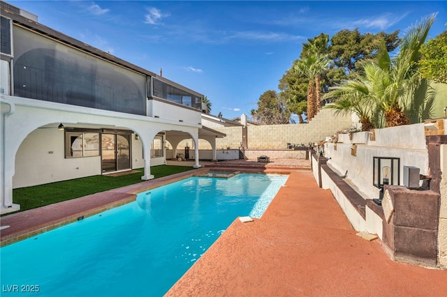 view of pool featuring a patio, a fenced in pool, and fence