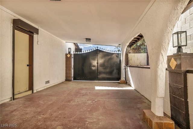 interior space with concrete block wall