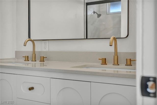 full bath featuring double vanity and a sink