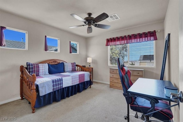 carpeted bedroom featuring visible vents, baseboards, and ceiling fan