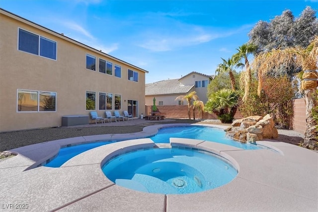 view of pool featuring a fenced in pool, a patio, an in ground hot tub, and a fenced backyard