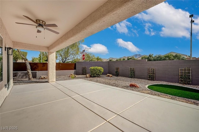 view of patio / terrace featuring a fenced backyard and ceiling fan