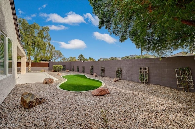 view of yard featuring a fenced backyard and a patio