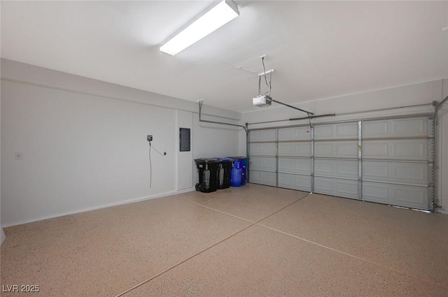 garage with electric panel and a garage door opener