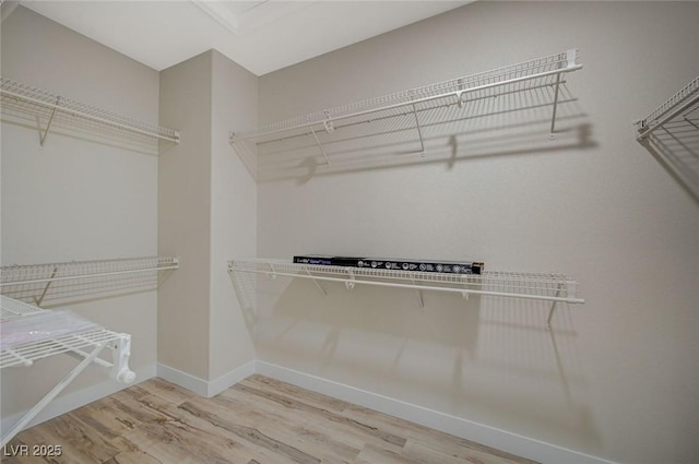 spacious closet with wood finished floors