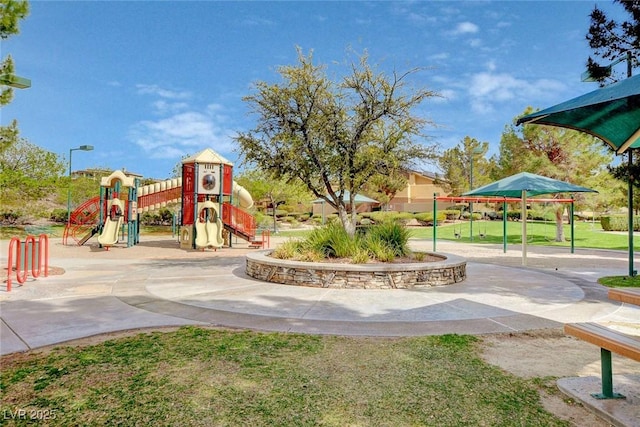 community playground featuring a lawn