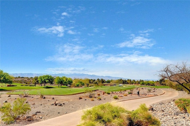 surrounding community with golf course view and a mountain view