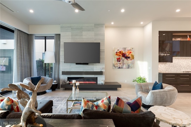 515 Serenity Point Dr, Henderson, NV 89012 - living area featuring ceiling fan, a tile fireplace, and recessed lighting