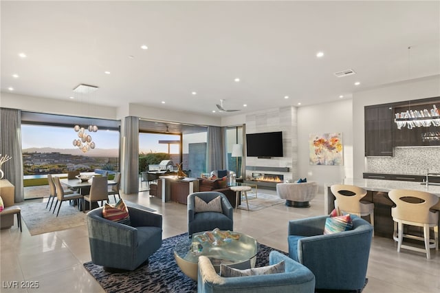 living room featuring visible vents, recessed lighting, and a fireplace