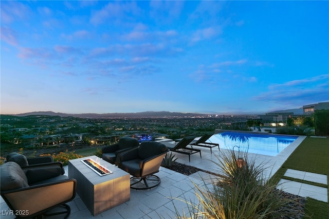 515 Serenity Point Dr, Henderson, NV 89012 - view of swimming pool featuring an outdoor fire pit, a patio area, and a mountain view