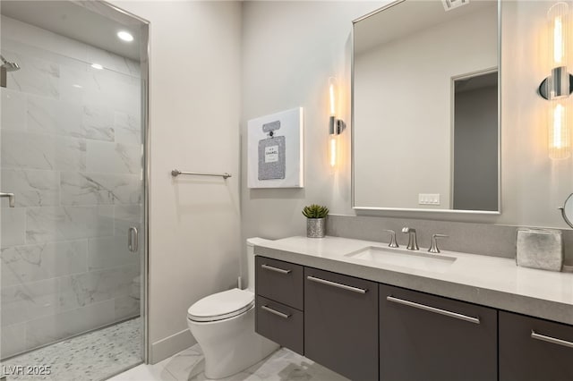 full bath featuring toilet, marble finish floor, a stall shower, and vanity