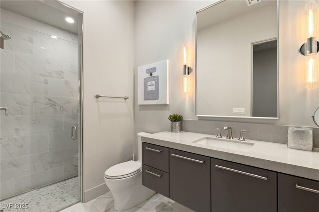 515 Serenity Point Dr, Henderson, NV 89012 - bathroom featuring marble look tile flooring, a shower stall, toilet, vanity, and baseboards