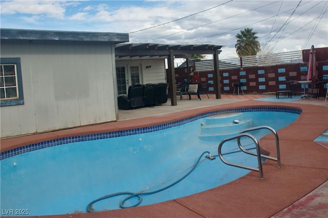 view of swimming pool featuring a fenced in pool, french doors, and a patio