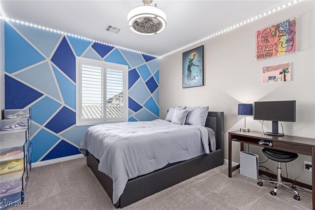 bedroom with baseboards, visible vents, and carpet floors