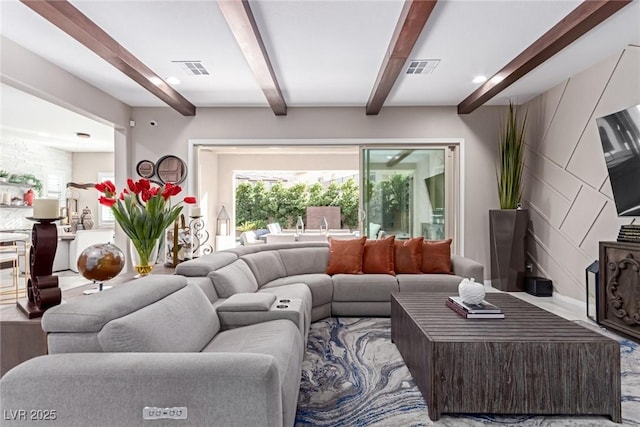 living room featuring visible vents, beam ceiling, and wood finished floors