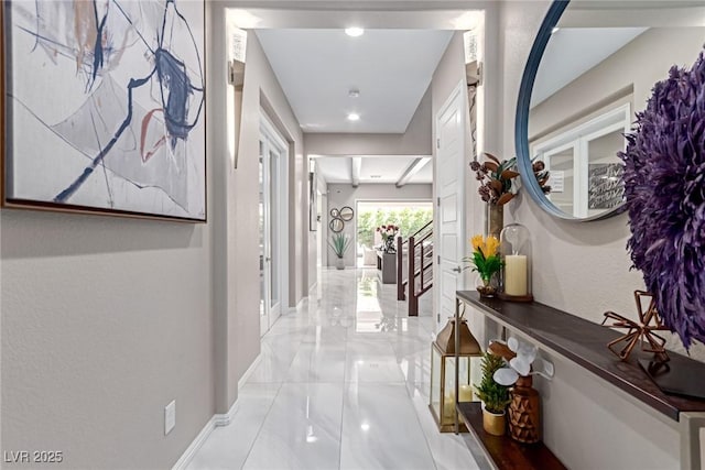 hallway featuring baseboards