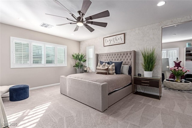 carpeted bedroom with visible vents, recessed lighting, a ceiling fan, and baseboards