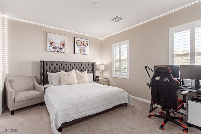 bedroom featuring visible vents, baseboards, and carpet floors