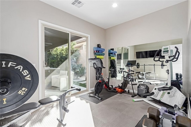 exercise area featuring recessed lighting, visible vents, and carpet